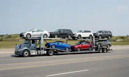 Multi-level car carrier on the highway to Belfast, Maine, United States
