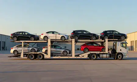 Car transporter parked in an industrial area of Biddeford, Maine, United States