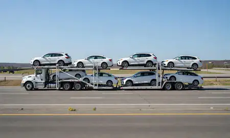 Multi-level car carrier on the highway to Brewer, Maine, United States