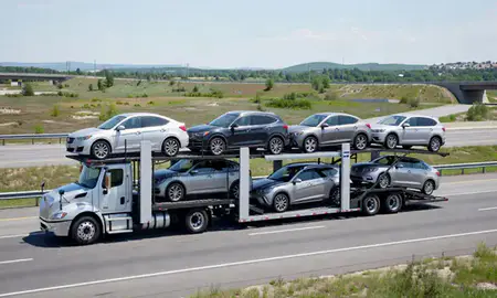 Multi-level car carrier on the highway to Calais, Maine, United States