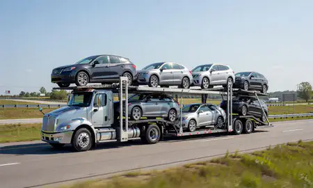 Multi-level car carrier on the highway to Cumberland Center, Maine, United States