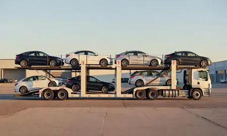 Car transporter parked in an industrial area of Cumberland Center, Maine, United States
