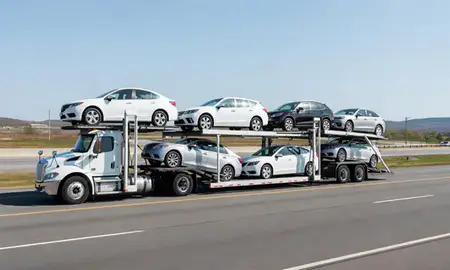 Multi-level car carrier on the highway to Ellsworth, Maine, United States