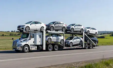 Multi-level car carrier on the highway to Lisbon Falls, Maine, United States