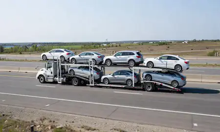 Multi-level car carrier on the highway to North Windham, Maine, United States