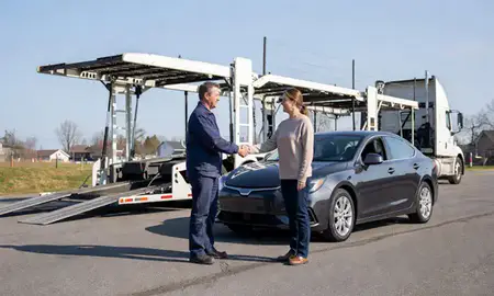 Vehicle owner beside their delivered car in North Windham, Maine, United States