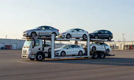 Car transporter loaded with vehicles in Portland, Maine, United States