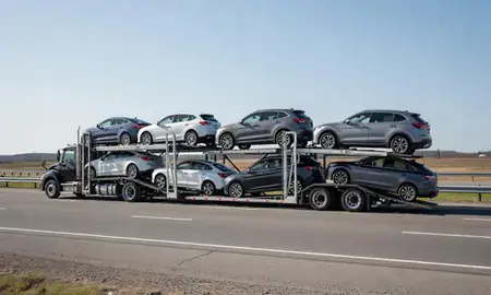 Multi-level car carrier on the highway to Presque Isle, Maine, United States