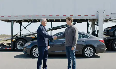 Vehicle owner beside their delivered car in Saco, Maine, United States