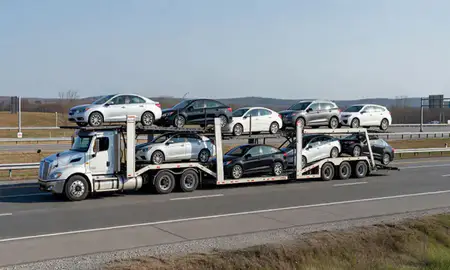 Multi-level car carrier on the highway to Sanford, Maine, United States