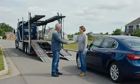 Vehicle owner beside their delivered car in South Berwick, Maine, United States