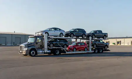 Car transporter loaded with vehicles in South Eliot, Maine, United States
