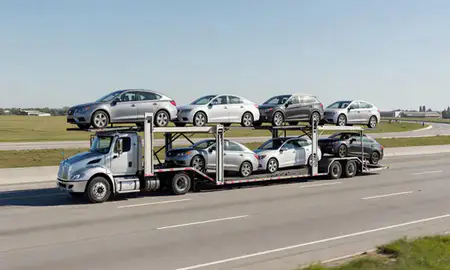 Multi-level car carrier on the highway to South Portland, Maine, United States