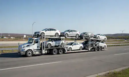 Multi-level car carrier on the highway to Westbrook, Maine, United States