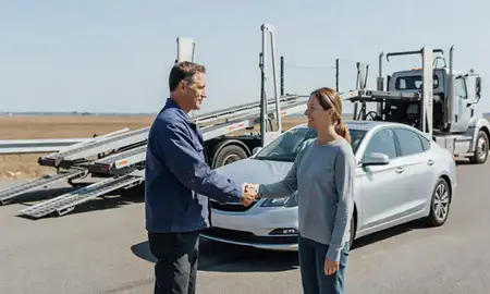 Vehicle owner beside their delivered car in Westbrook, Maine, United States