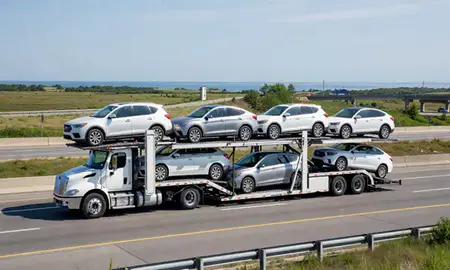 Multi-level car carrier on the highway to York Harbor, Maine, United States