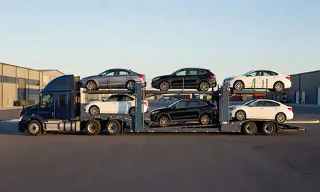 Car transporter parked in an industrial area of York Harbor, Maine, United States