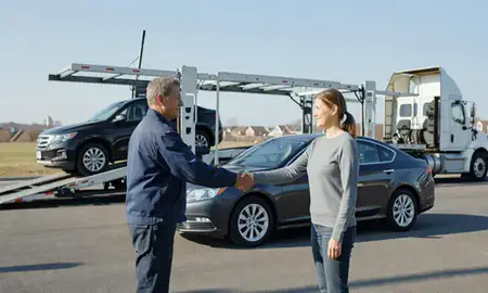 Vehicle owner beside their delivered car in Maryland, United States