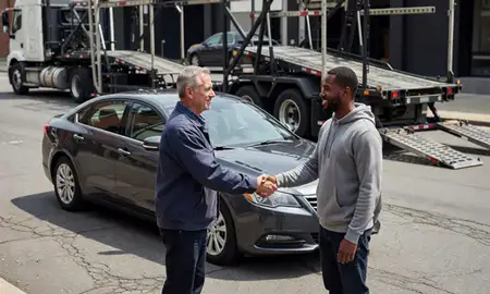 Vehicle owner beside their delivered car in Baltimore, Maryland, United States