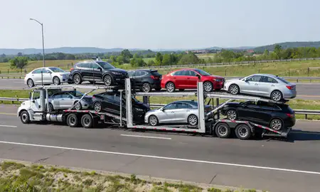 Multi-level car carrier on the highway to Bethesda, Maryland, United States