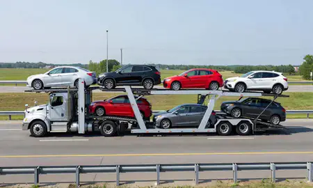 Multi-level car carrier on the highway to Dundalk, Maryland, United States