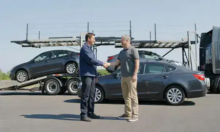 Vehicle owner beside their delivered car in Essex, Maryland, United States