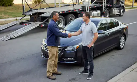 Vehicle owner beside their delivered car in Gaithersburg, Maryland, United States