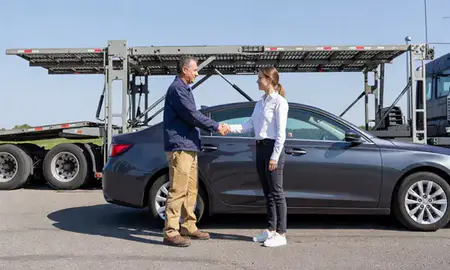 Vehicle owner beside their delivered car in Hagerstown, Maryland, United States