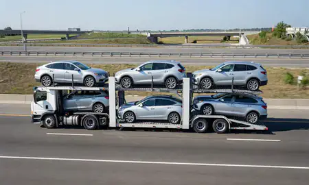 Multi-level car carrier on the highway to Potomac, Maryland, United States