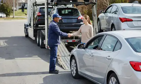 Vehicle owner beside their delivered car in Randallstown, Maryland, United States