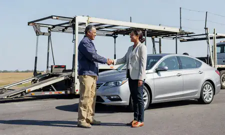 Vehicle owner beside their delivered car in Silver Spring, Maryland, United States
