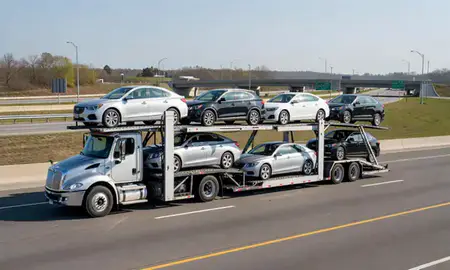 Multi-level car carrier on the highway to Towson, Maryland, United States
