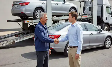 Vehicle owner beside their delivered car in Waldorf, Maryland, United States