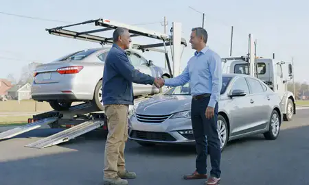 Vehicle owner beside their delivered car in Attleboro, Massachusetts, United States