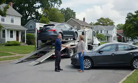 Vehicle owner beside their delivered car in Beverly, Massachusetts, United States