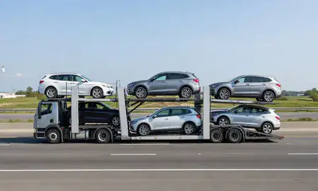 Multi-level car carrier on the highway to Cambridge, Massachusetts, United States