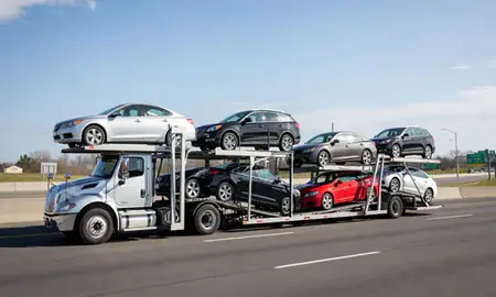 Multi-level car carrier on the highway to Chicopee, Massachusetts, United States