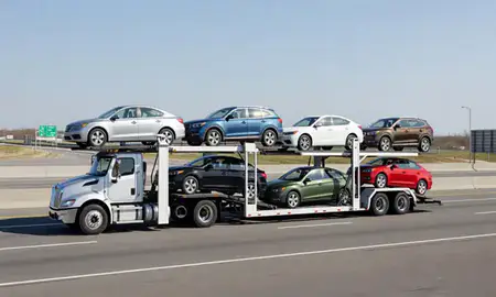 Multi-level car carrier on the highway to Everett, Massachusetts, United States