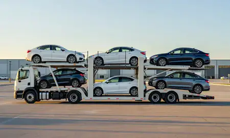 Car transporter parked in an industrial area of Fall River, Massachusetts, United States