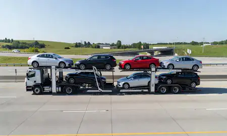 Multi-level car carrier on the highway to Leominster, Massachusetts, United States