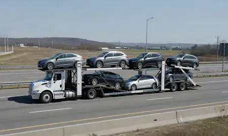 Multi-level car carrier on the highway to Lowell, Massachusetts, United States