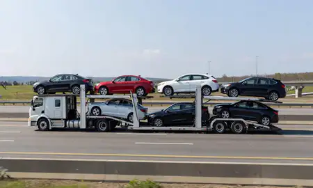 Multi-level car carrier on the highway to Lynn, Massachusetts, United States