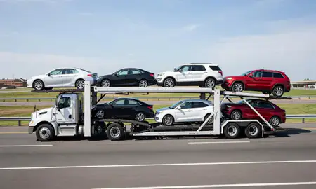 Multi-level car carrier on the highway to Medford, Massachusetts, United States