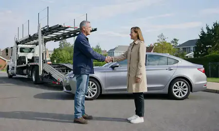 Vehicle owner beside their delivered car in Medford, Massachusetts, United States