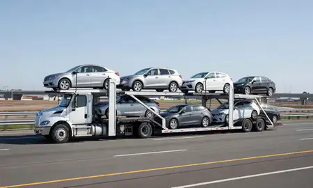 Multi-level car carrier on the highway to New Bedford, Massachusetts, United States