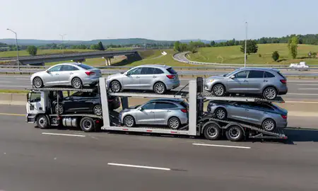 Multi-level car carrier on the highway to Newton, Massachusetts, United States