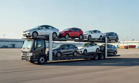 Car transporter loaded with vehicles in Newton, Massachusetts, United States