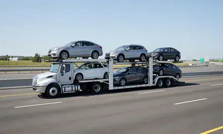 Multi-level car carrier on the highway to Peabody, Massachusetts, United States