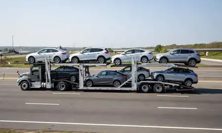 Multi-level car carrier on the highway to Quincy, Massachusetts, United States