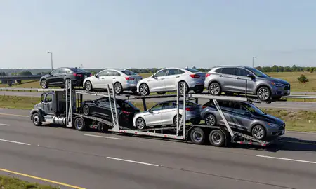 Multi-level car carrier on the highway to Revere, Massachusetts, United States